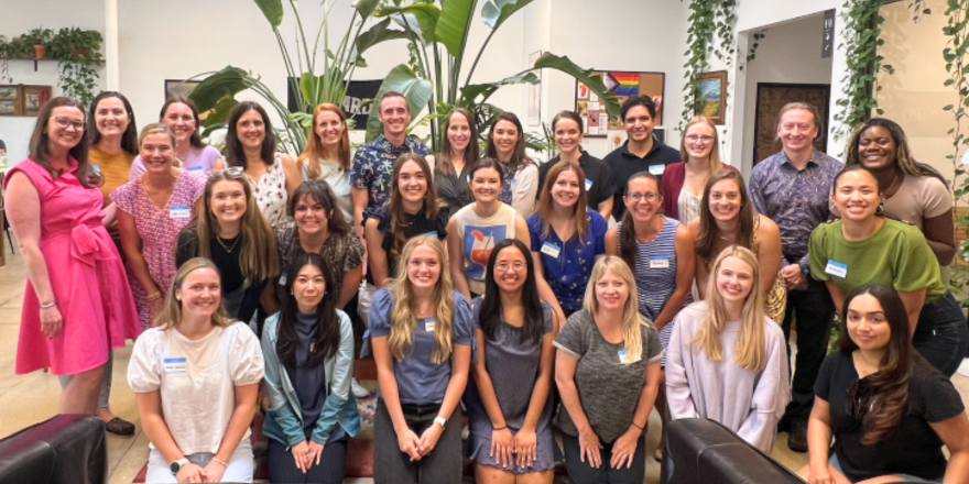 26 women and 3 men pose as s group
